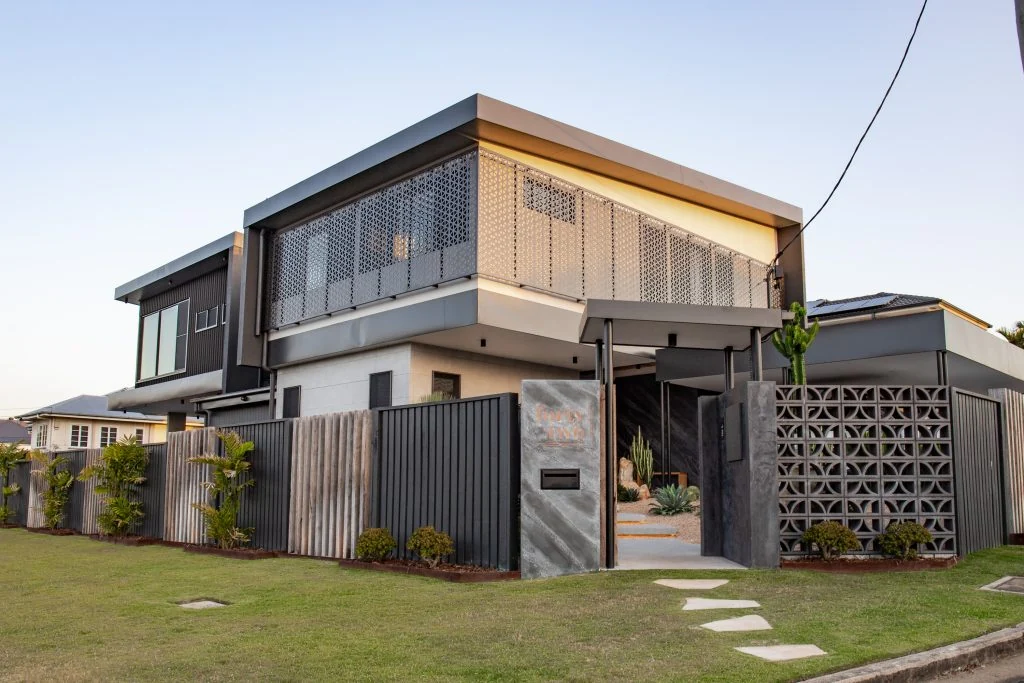 Photograph of large modern home from street